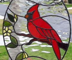 Cardinal in an oval frame.